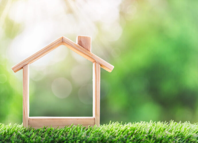 Wooden,Model,House,Place,On,The,Grass.,Concept,Of,Real Wooden,Model,House,Place,On,The,Grass.,Concept,Of,Real